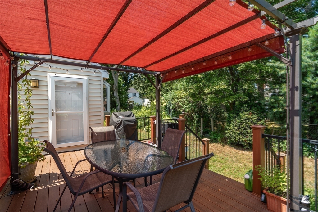 1 Cheryl Road Natick, MA 01760 - Photo 28 of 31 a balcony view with a dining table and chairs