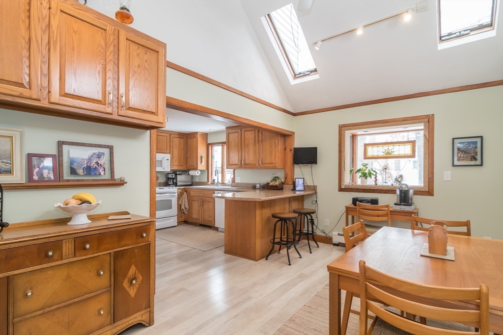 1 Cheryl Road Natick, MA 01760 - Photo 3 of 31 a kitchen with a sink stove and cabinets
