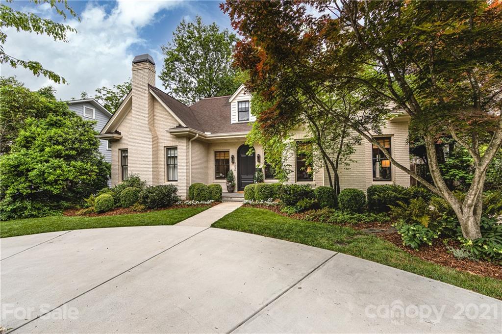 2230 Sharon Road Charlotte, NC 28207 - Photo 2 of 43 a front view of a house with a yard and trees