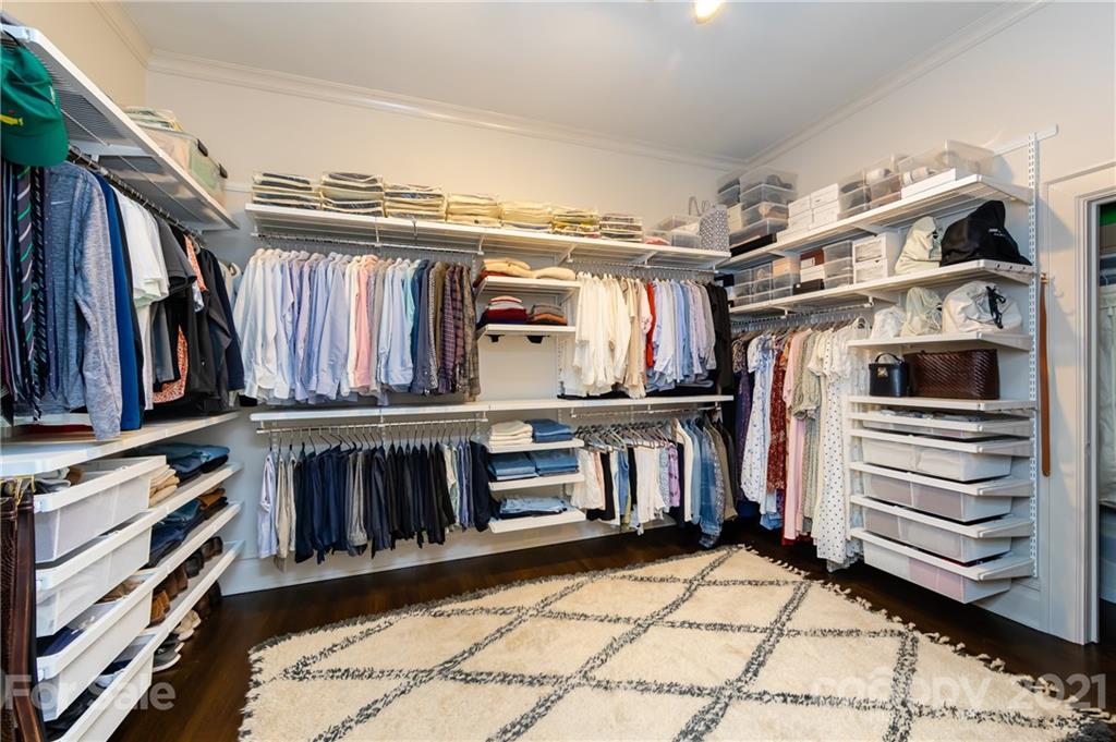 2230 Sharon Road Charlotte, NC 28207 - Photo 12 of 43 a view of walk in closet with clothes and shoes