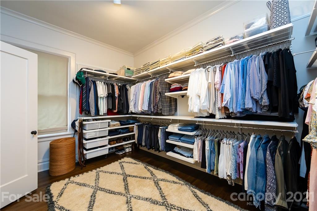 2230 Sharon Road Charlotte, NC 28207 - Photo 13 of 43 a view of walk in closet with clothes and shoes