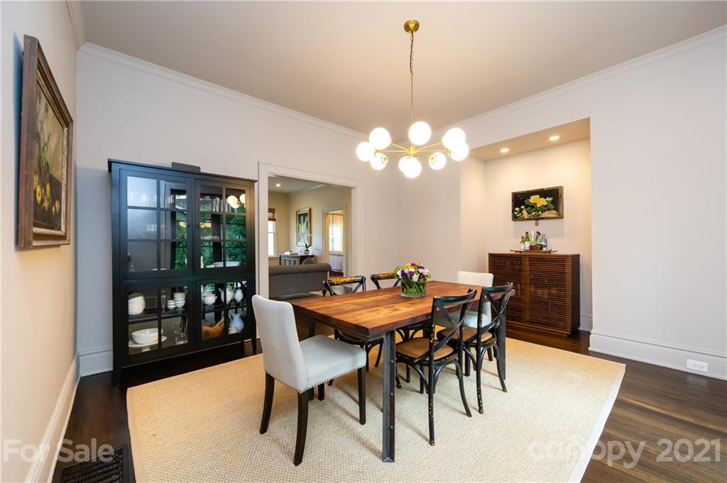 2230 Sharon Road Charlotte, NC 28207 - Photo 17 of 43 a view of a dining room with furniture and wooden floor