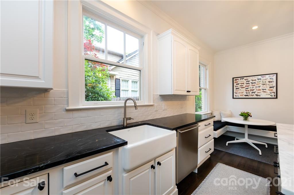 2230 Sharon Road Charlotte, NC 28207 - Photo 20 of 43 a kitchen that has a sink and a stove in it