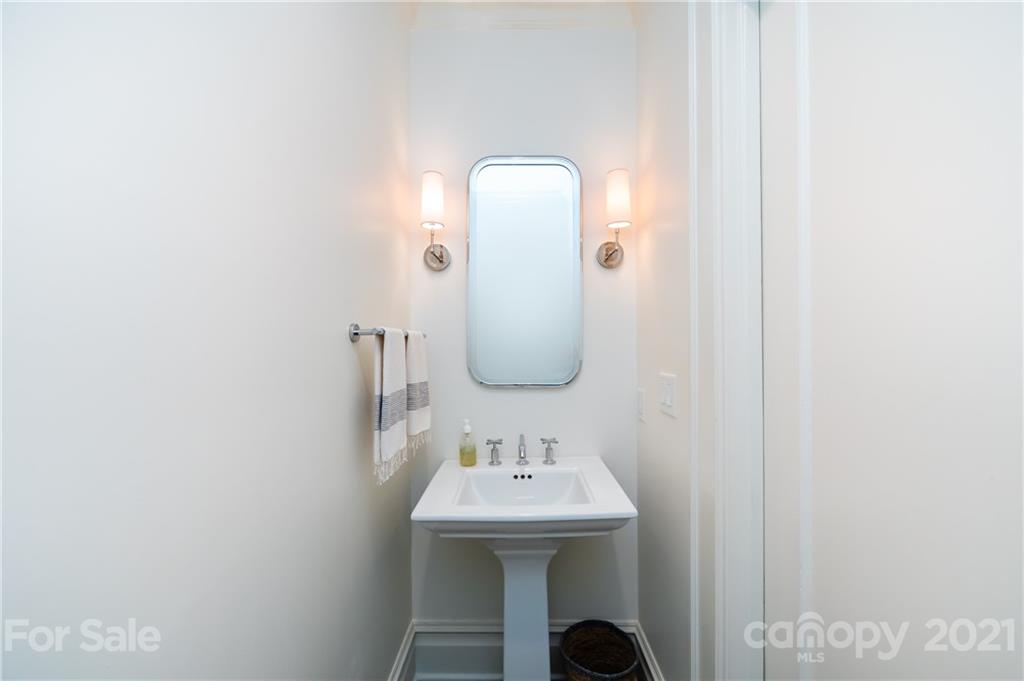 2230 Sharon Road Charlotte, NC 28207 - Photo 26 of 43 a bathroom with a sink and a mirror