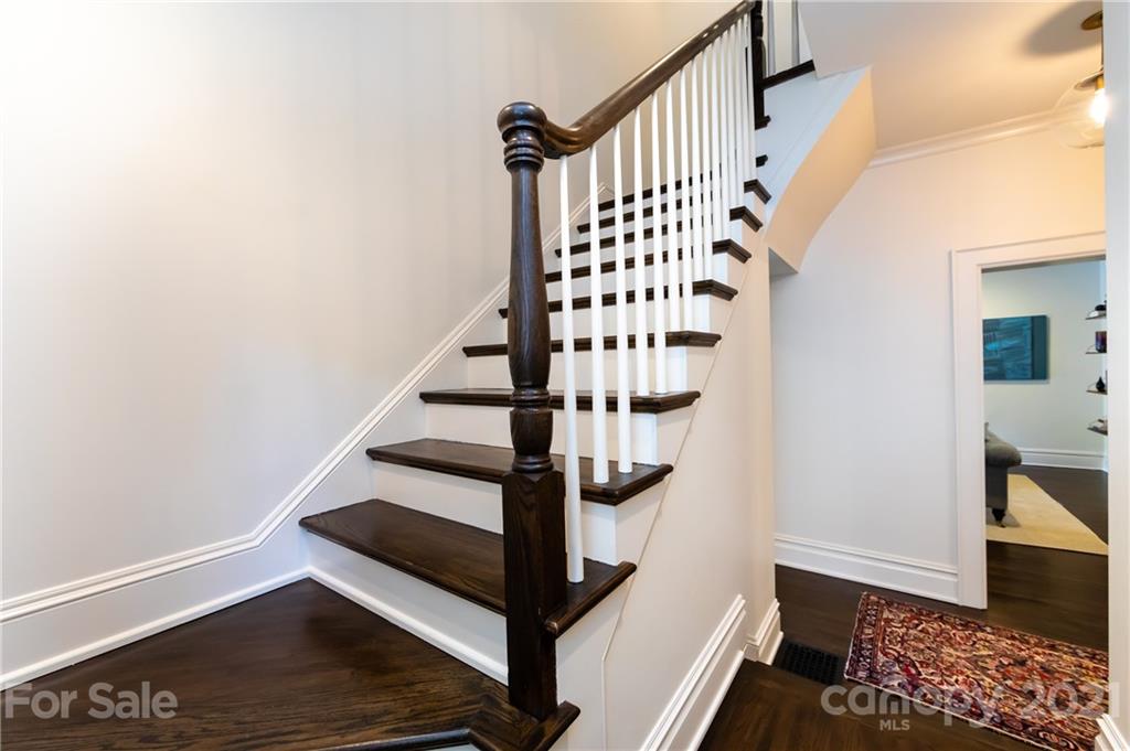2230 Sharon Road Charlotte, NC 28207 - Photo 28 of 43 a view of entryway with stairs and wooden floor