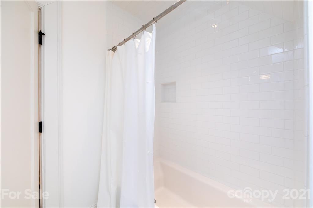 2230 Sharon Road Charlotte, NC 28207 - Photo 33 of 43 a bathroom with a shower and a tub