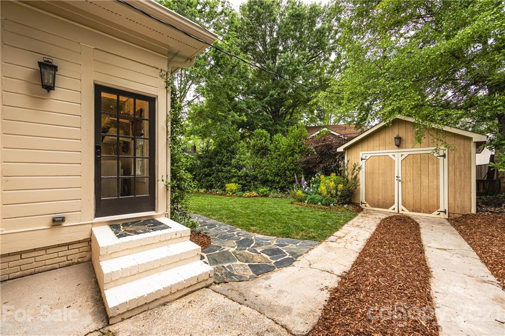 2230 Sharon Road Charlotte, NC 28207 - Photo 37 of 43 a front view of a house with garden