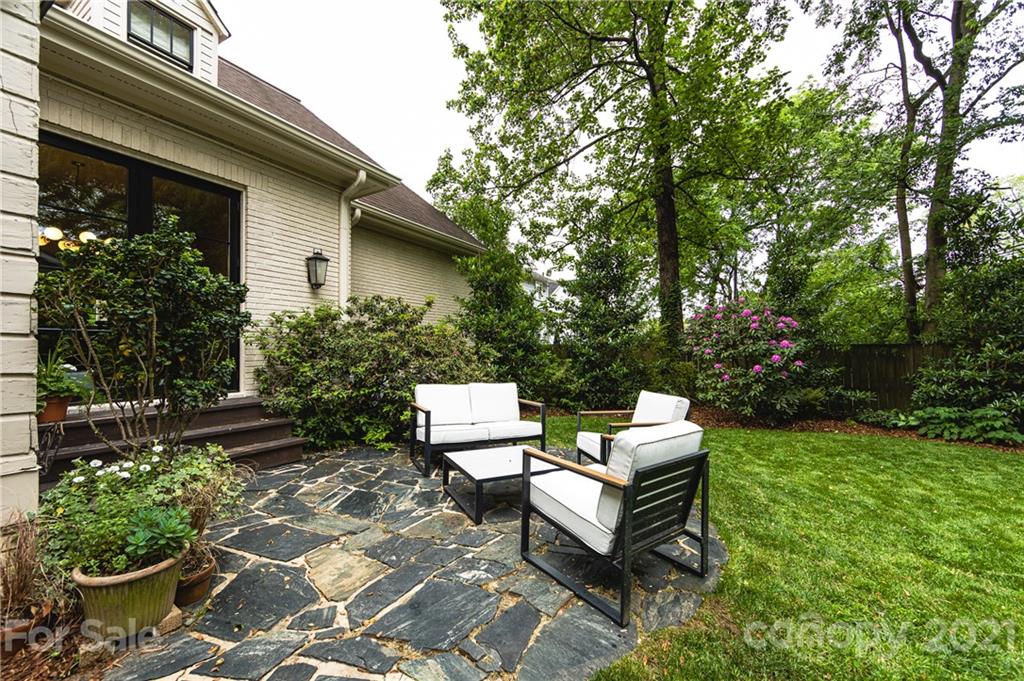 2230 Sharon Road Charlotte, NC 28207 - Photo 39 of 43 a backyard of a house with outdoor seating