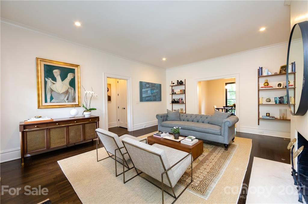 2230 Sharon Road Charlotte, NC 28207 - Photo 5 of 43 a living room with fireplace furniture and wooden floor