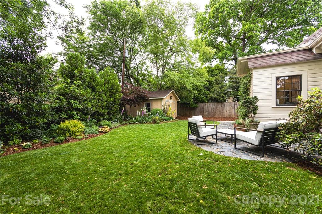 2230 Sharon Road Charlotte, NC 28207 - Photo 42 of 43 a view of a backyard with sitting area