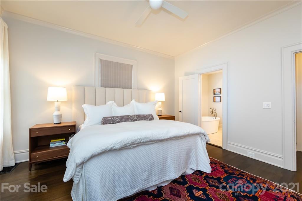 2230 Sharon Road Charlotte, NC 28207 - Photo 8 of 43 a bedroom with a bed and a dresser