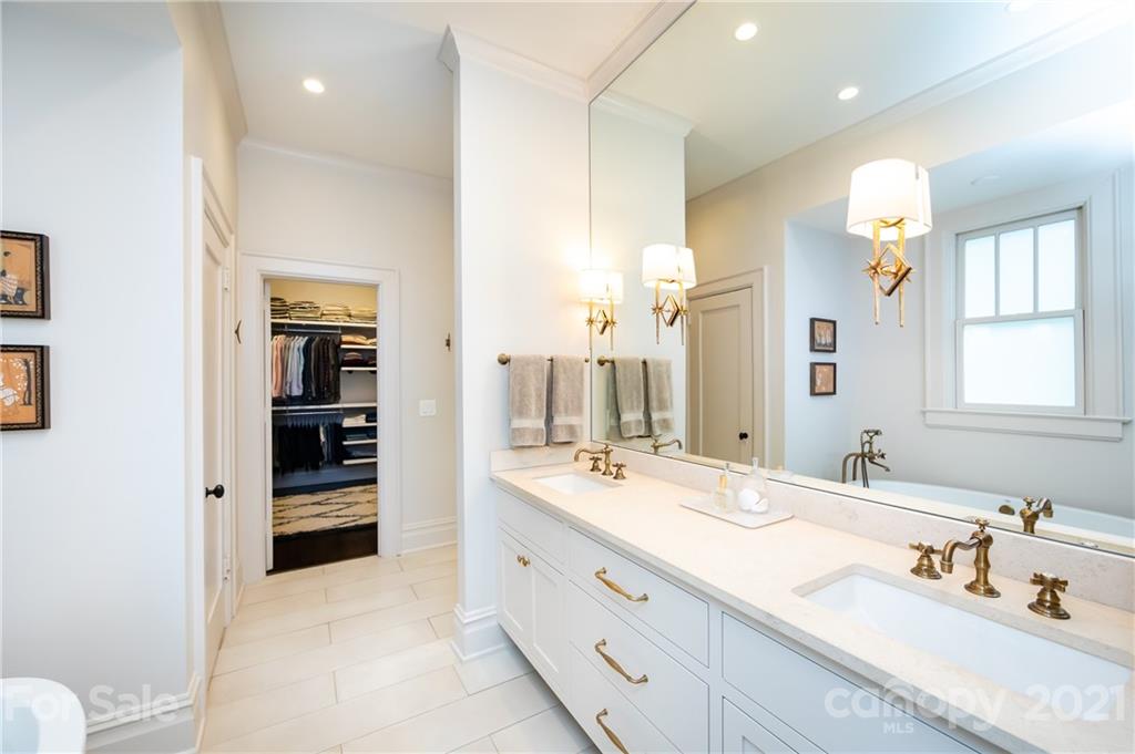 2230 Sharon Road Charlotte, NC 28207 - Photo 9 of 43 a spacious bathroom with a granite countertop sink mirror and