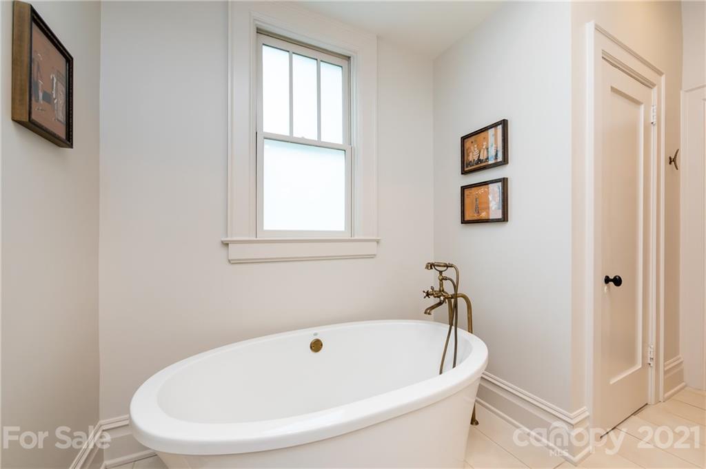 2230 Sharon Road Charlotte, NC 28207 - Photo 10 of 43 a white bath tub sitting next to a white sink