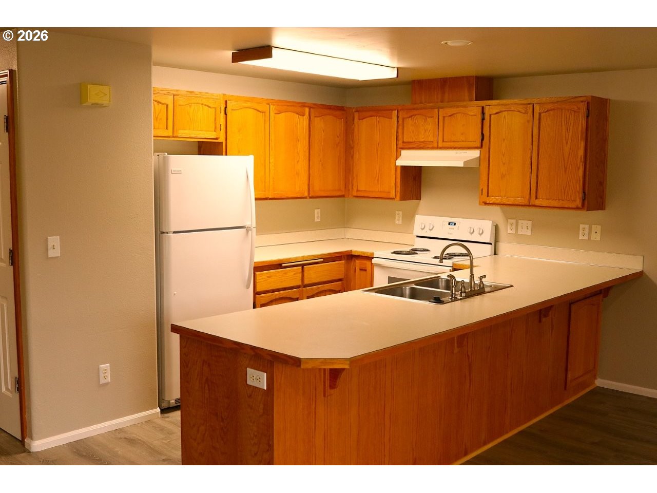 460 Autumn Avenue Eugene, OR 97404 - Photo 4 of 21 a kitchen with a sink a stove and a refrigerator