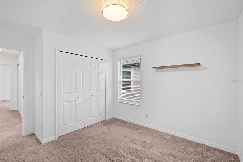 37820 Beacon Brick Drive Zephyrhills, FL 33540 - Photo 15 of 26 an empty room with windows