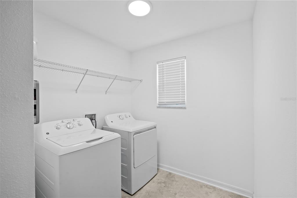 37820 Beacon Brick Drive Zephyrhills, FL 33540 - Photo 17 of 26 a utility room with dryer and washer