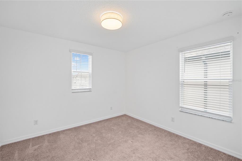 37820 Beacon Brick Drive Zephyrhills, FL 33540 - Photo 18 of 26 an empty room with windows