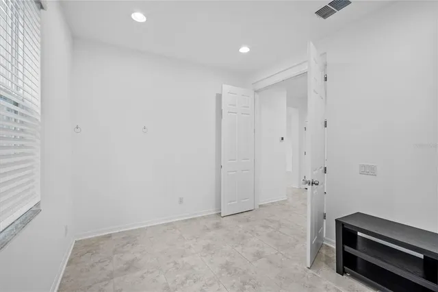 a view of room with air conditioner and window