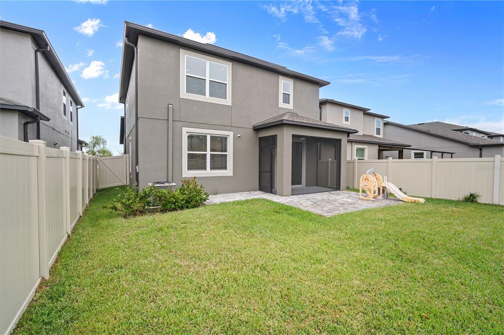 37820 Beacon Brick Drive Zephyrhills, FL 33540 - Photo 21 of 26 a view of a house with backyard and porch