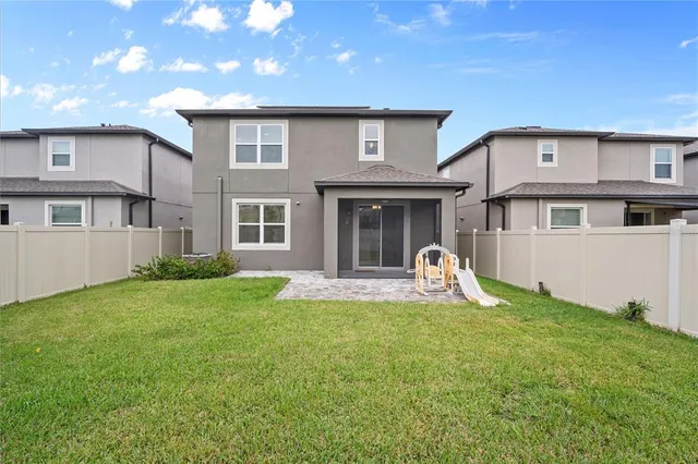 a view of a house with backyard porch and garden