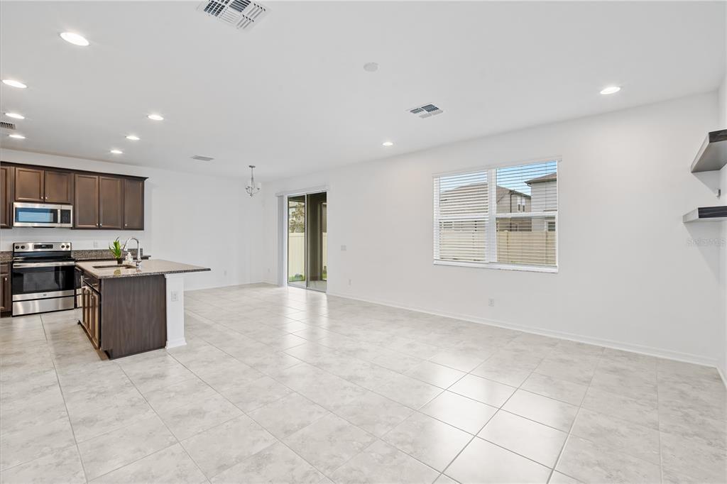 37820 Beacon Brick Drive Zephyrhills, FL 33540 - Photo 7 of 26 a view of kitchen with stainless steel appliances cabinets