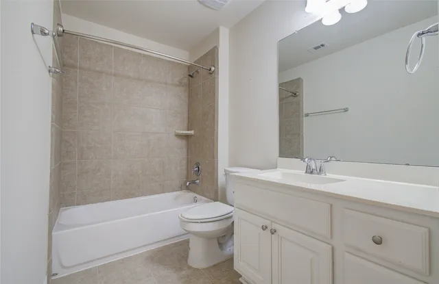 a view of a porch with chairs and floor to ceiling window