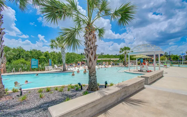 a view of a swimming pool with outdoor seating