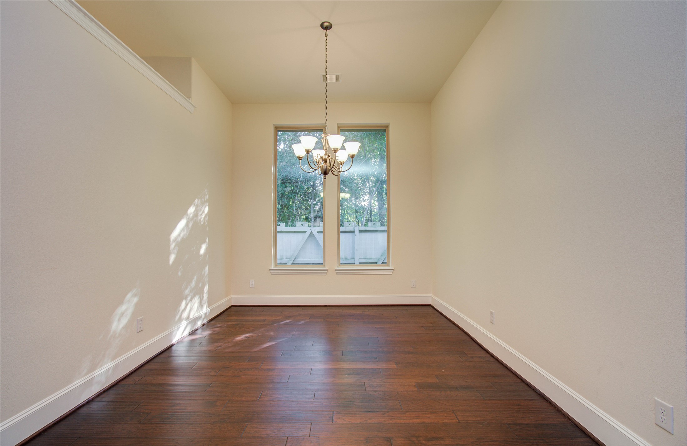 10202 South Goshawk Trail Conroe, TX 77385 - Photo 8 of 50 Formal dining is tucked away and open to the living space.