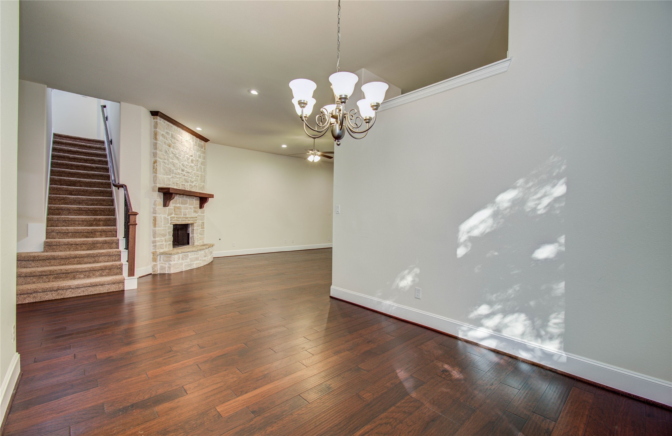 10202 South Goshawk Trail Conroe, TX 77385 - Photo 9 of 50 Formal dining is tucked away and open to the living space.