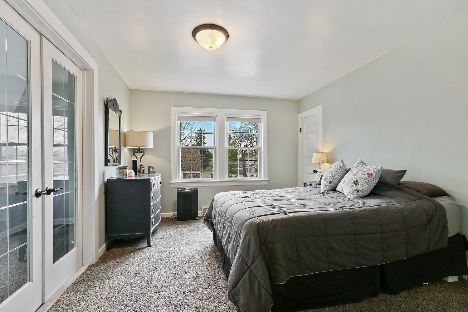 6448 175th Street Tinley Park, IL 60477 - Photo 11 of 18 a bedroom with a bed and a dresser next to a window
