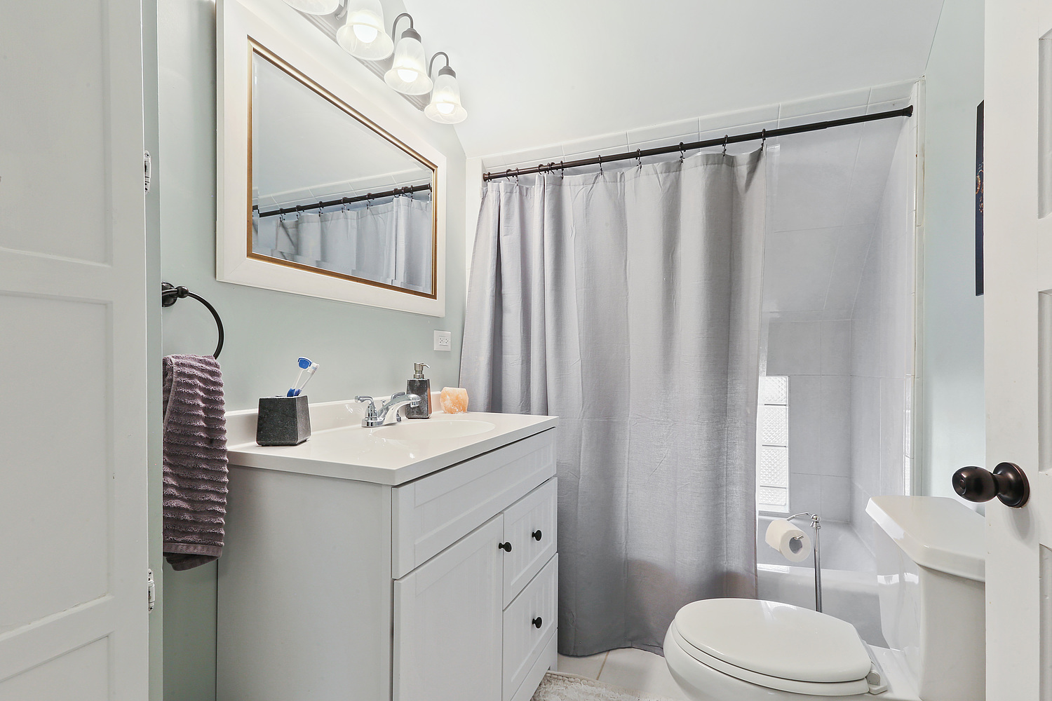 6448 175th Street Tinley Park, IL 60477 - Photo 13 of 18 a bathroom with a sink a toilet and mirror