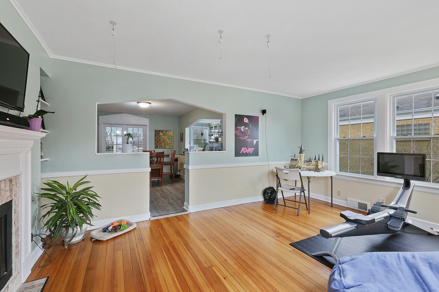 6448 175th Street Tinley Park, IL 60477 - Photo 2 of 18 a living room with furniture and a flat screen tv