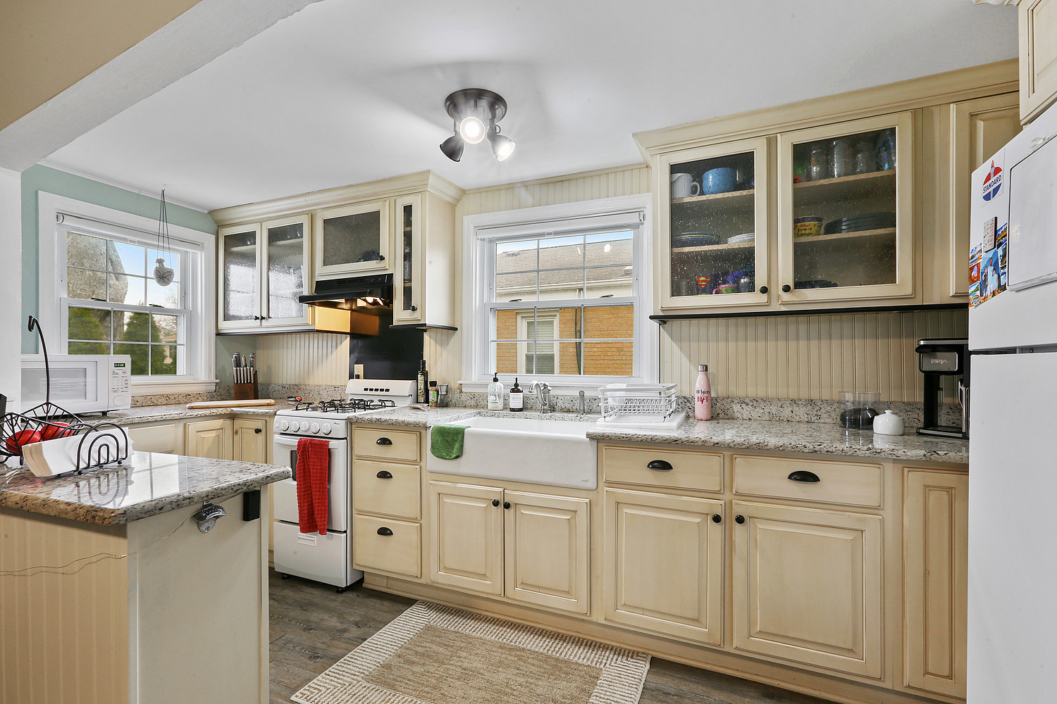 6448 175th Street Tinley Park, IL 60477 - Photo 5 of 18 a kitchen with a stove and cabinets