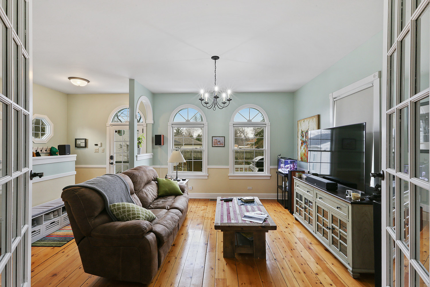 6448 175th Street Tinley Park, IL 60477 - Photo 7 of 18 a living room with furniture and a flat screen tv