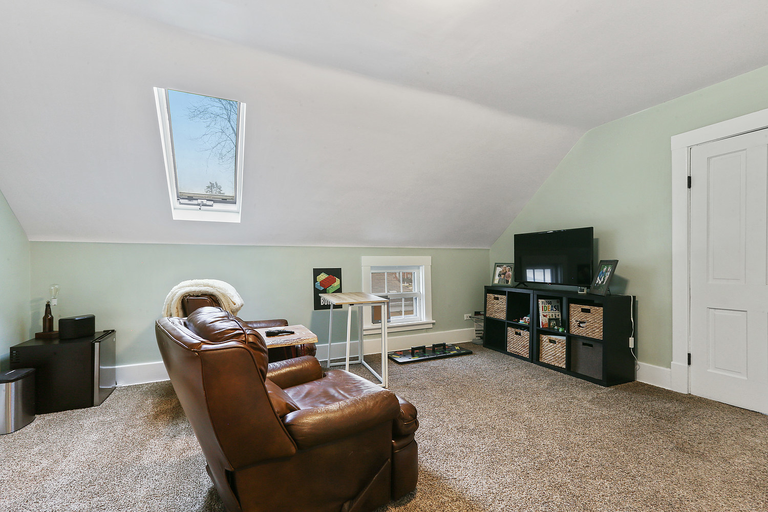 6448 175th Street Tinley Park, IL 60477 - Photo 9 of 18 a living room with furniture a flat screen tv and a window