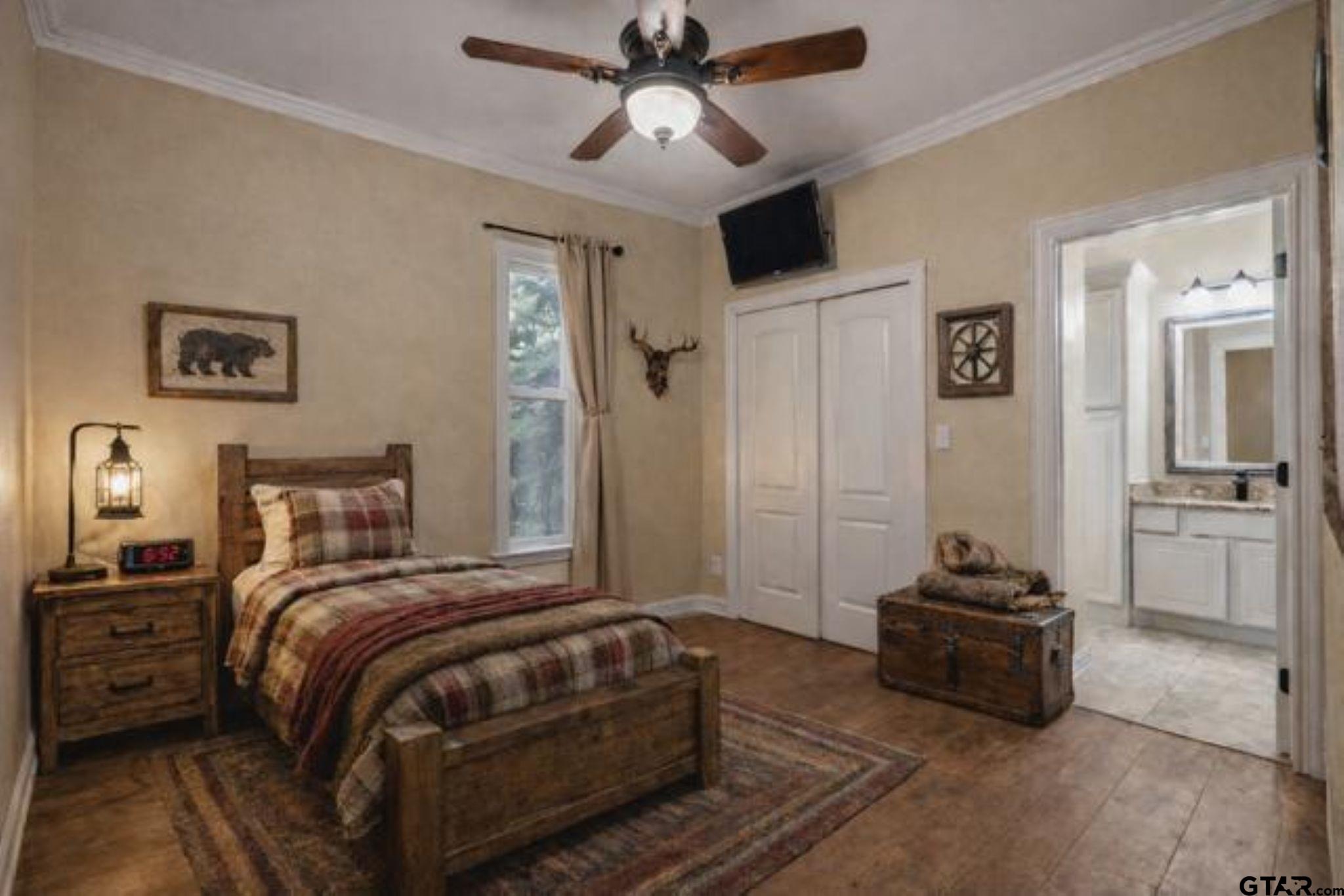 14740 Fm 1255 Canton, TX 75103 - Photo 10 of 40 a bedroom with a bed and a chandelier