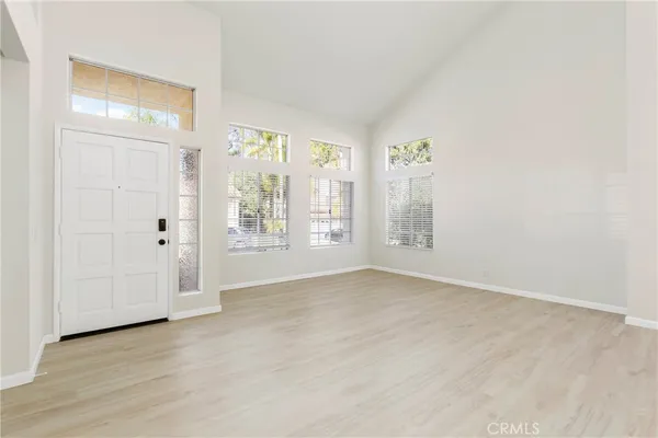 a view of an empty room with a window