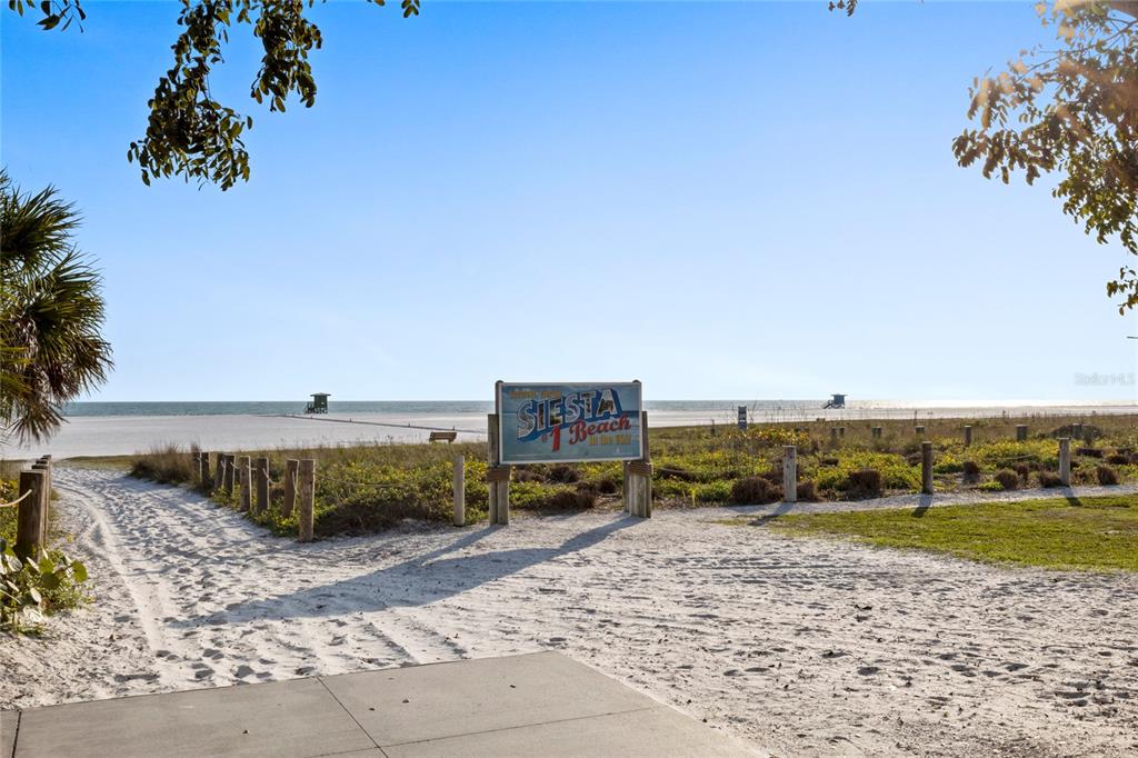 2946 Clark Road, Unit 2946 Sarasota, FL 34231 - Photo 27 of 34 a view of a terrace with a lake