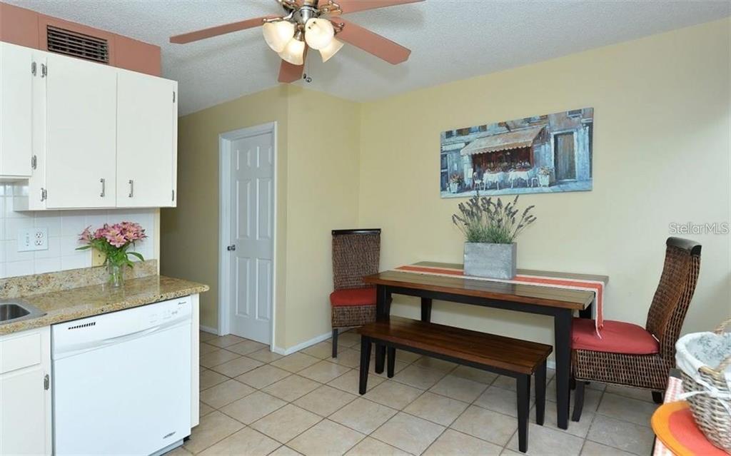 2946 Clark Road, Unit 2946 Sarasota, FL 34231 - Photo 5 of 34 a view of a dining room with furniture