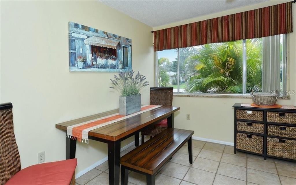 2946 Clark Road, Unit 2946 Sarasota, FL 34231 - Photo 6 of 34 a room with furniture and window