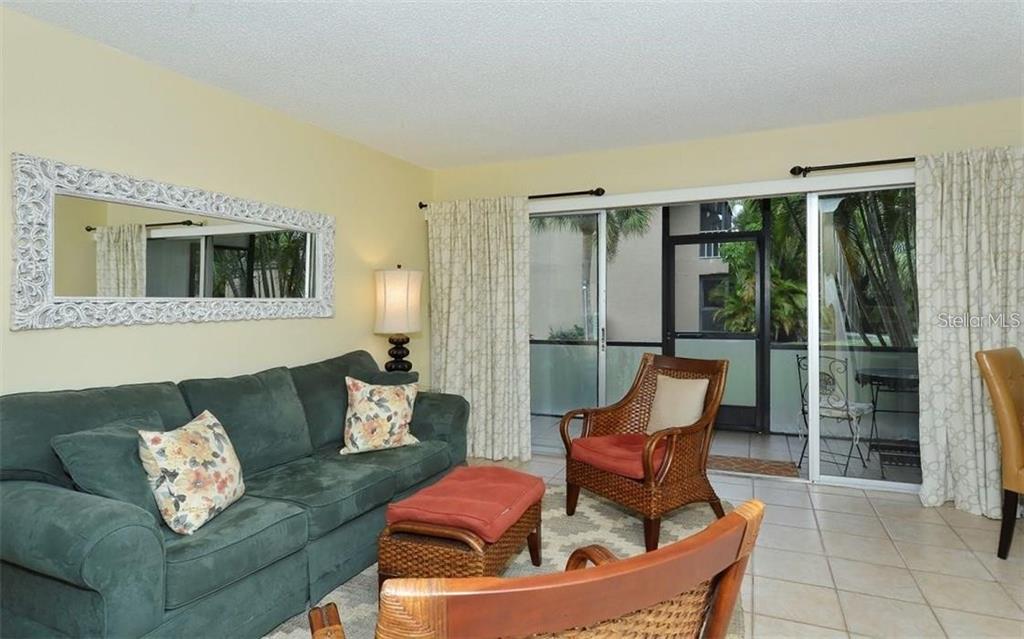 2946 Clark Road, Unit 2946 Sarasota, FL 34231 - Photo 8 of 34 a outdoor living space with furniture