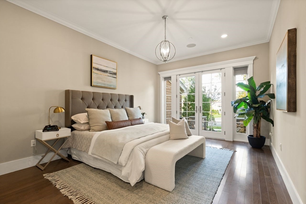 5 Gershon Way, Unit 5 Winchester, MA 01890 - Photo 13 of 27 a bedroom with bed and a large window