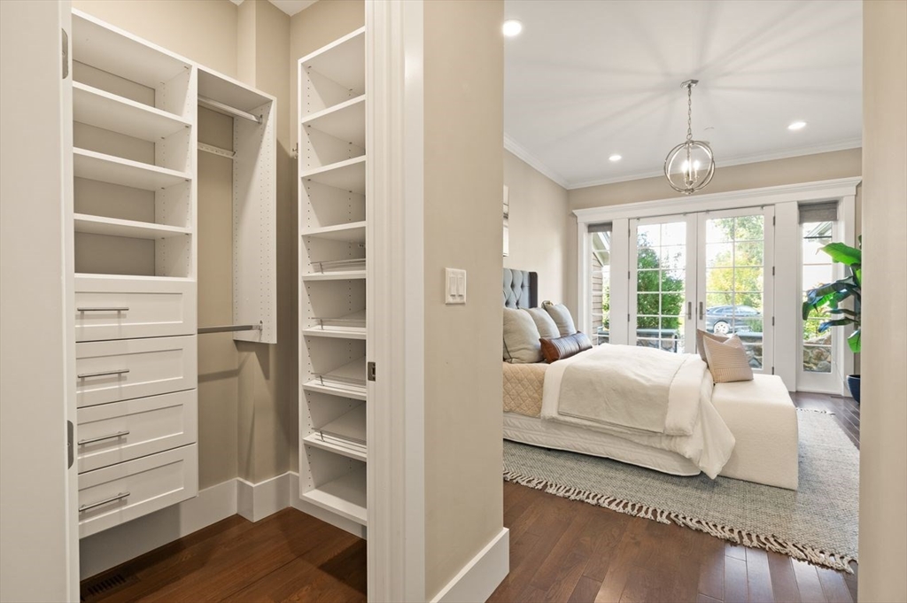 5 Gershon Way, Unit 5 Winchester, MA 01890 - Photo 14 of 27 a bedroom with a bed and wooden floor