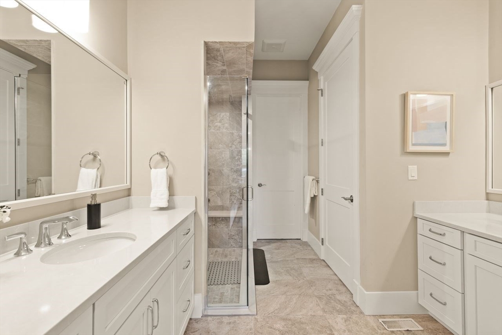5 Gershon Way, Unit 5 Winchester, MA 01890 - Photo 15 of 27 a spacious bathroom with a double vanity sink mirror and shower