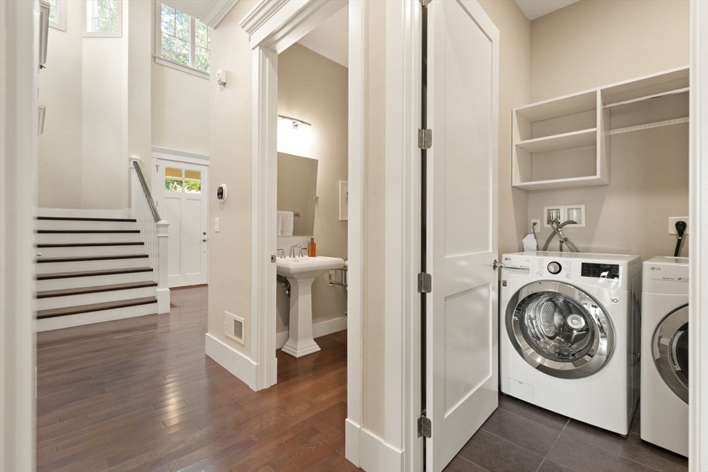 5 Gershon Way, Unit 5 Winchester, MA 01890 - Photo 17 of 27 a view of a hallway with washer and dryer