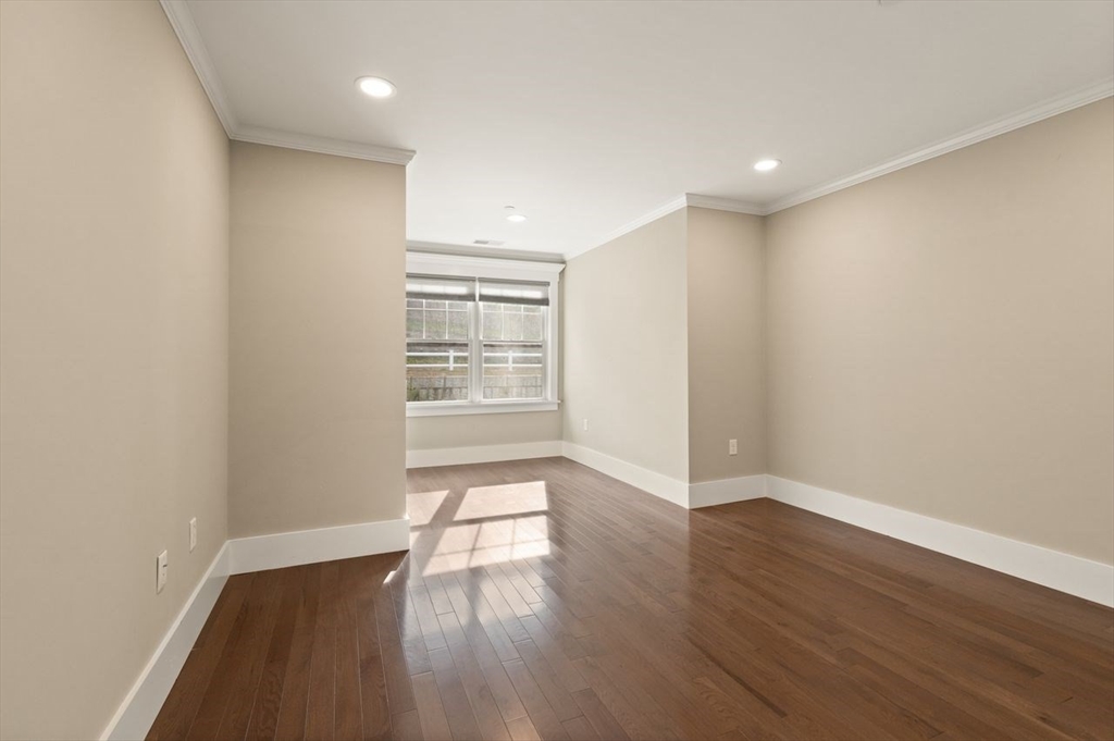5 Gershon Way, Unit 5 Winchester, MA 01890 - Photo 21 of 27 wooden floor in an empty room with a window