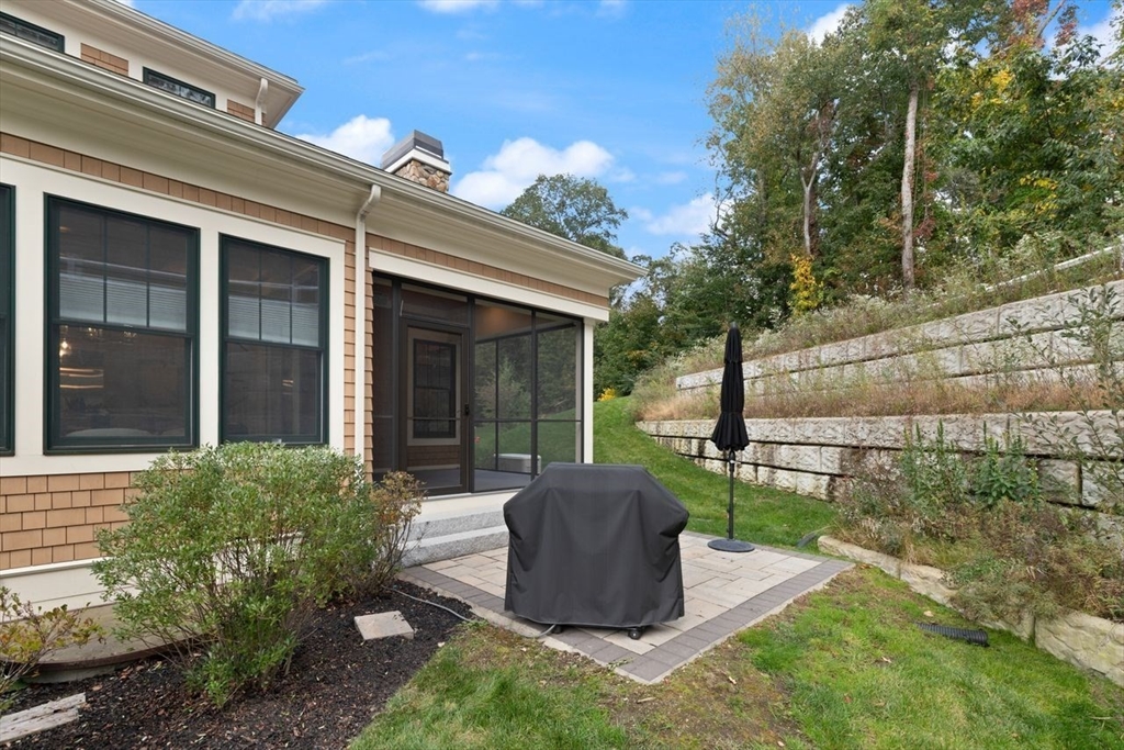 5 Gershon Way, Unit 5 Winchester, MA 01890 - Photo 24 of 27 a view of a house with backyard sitting area and garden