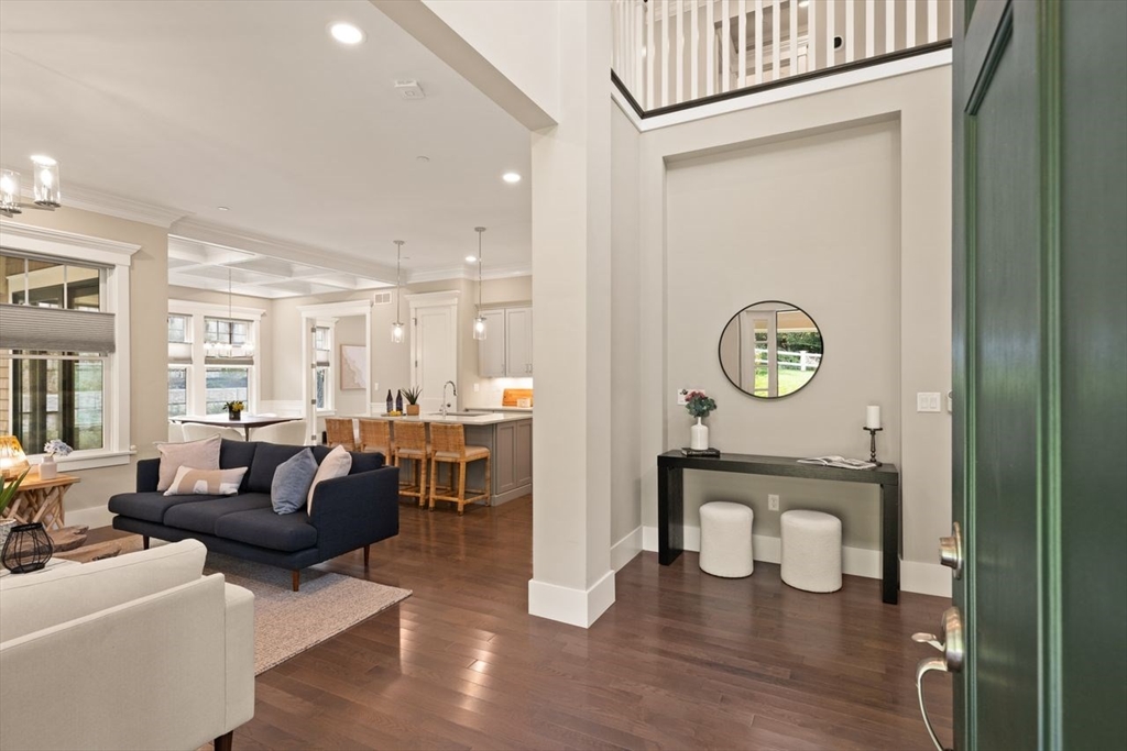 5 Gershon Way, Unit 5 Winchester, MA 01890 - Photo 3 of 27 a living room with furniture and a wooden floor