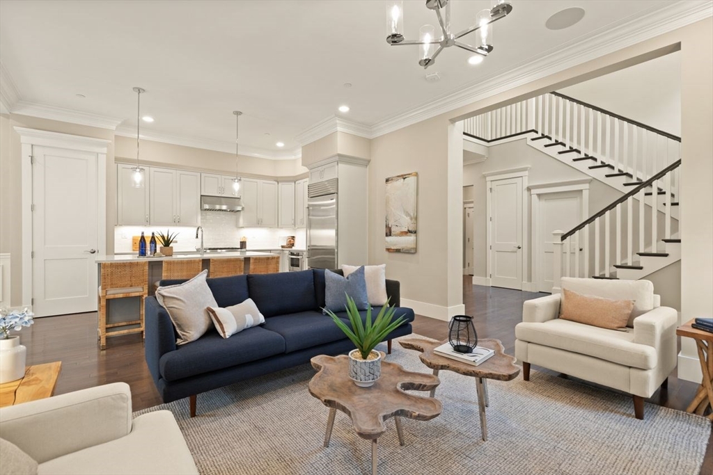 5 Gershon Way, Unit 5 Winchester, MA 01890 - Photo 5 of 27 a living room with furniture kitchen view and a chandelier