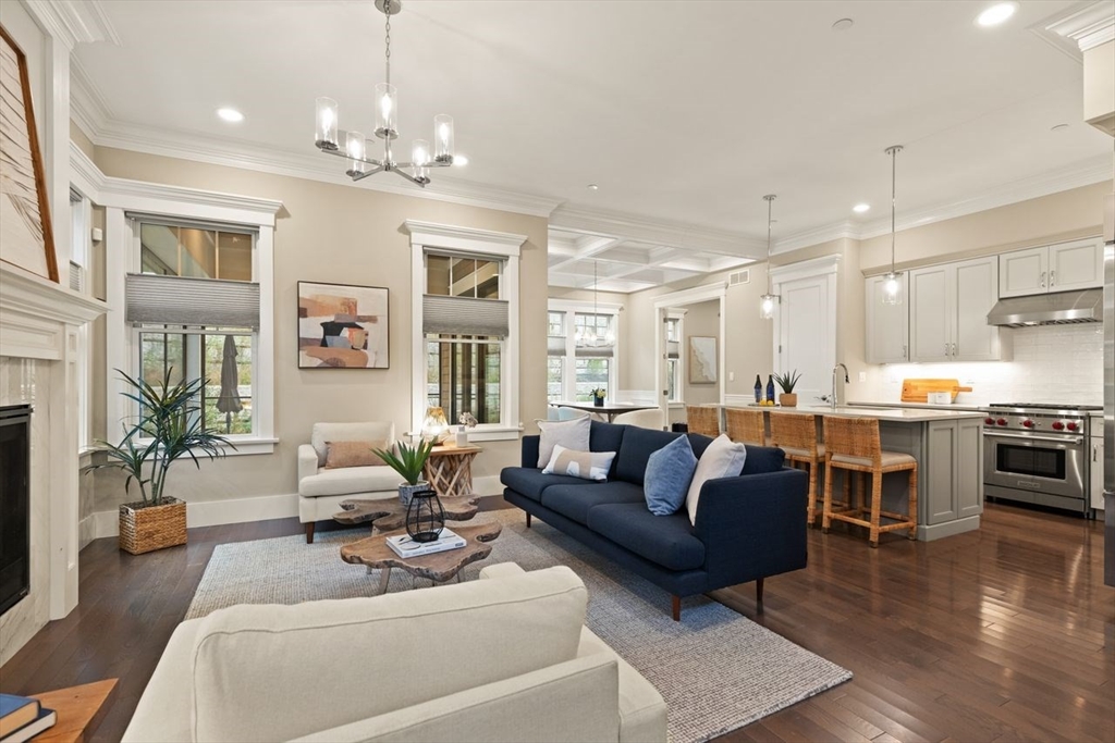 5 Gershon Way, Unit 5 Winchester, MA 01890 - Photo 6 of 27 a living room with furniture kitchen and a chandelier